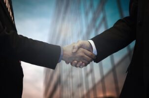 Merger and Acquisition Consultants shaking hands