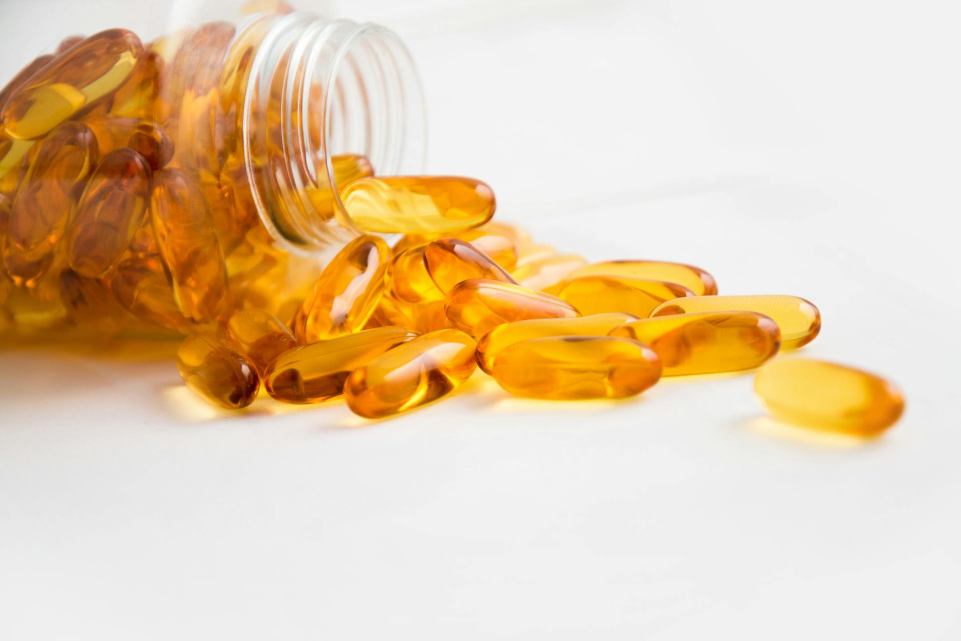 medine gel caps spilling out of bottle
