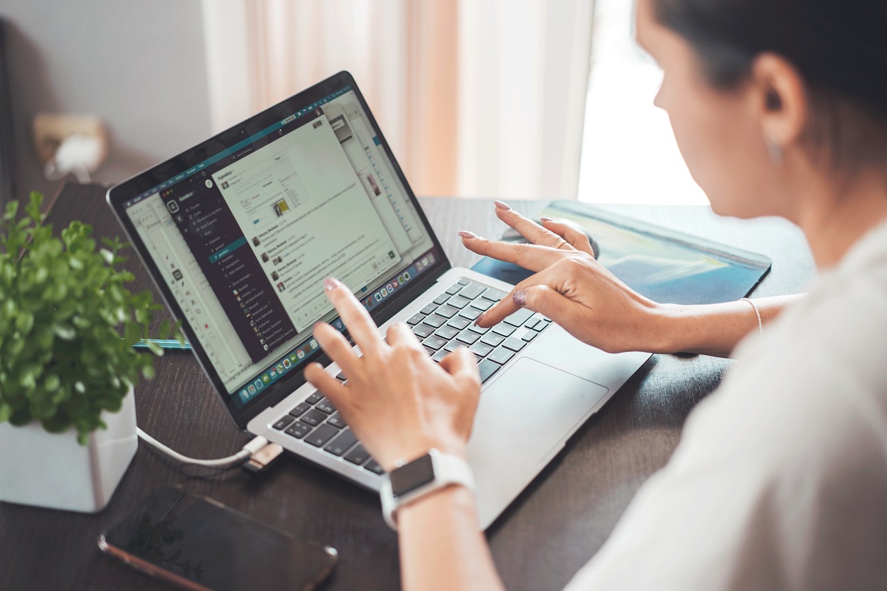 On-Demand Business Consultant Services: Fractional Leaders & Specialist Squads Image of woman typing on a laptop