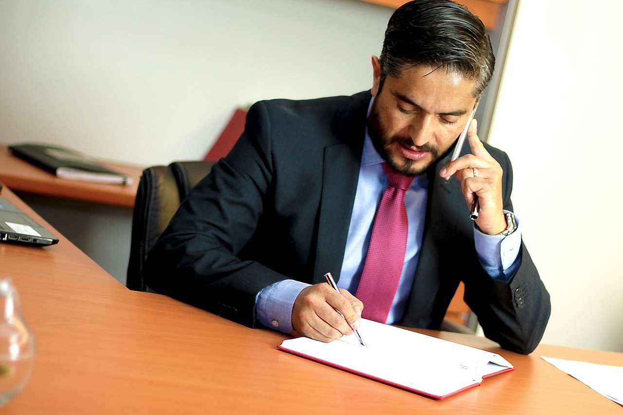 Image of man in business suit on the phone
