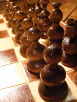 Image of chess pieces on a board