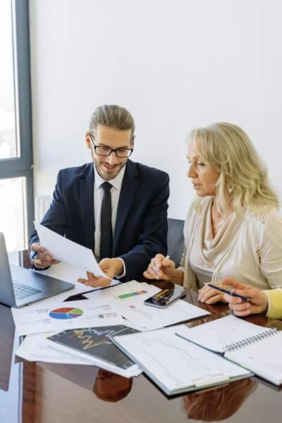 Women in blazers having a meeting in an office