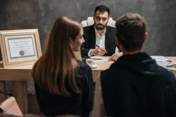 Image of 3 people meeting and talking