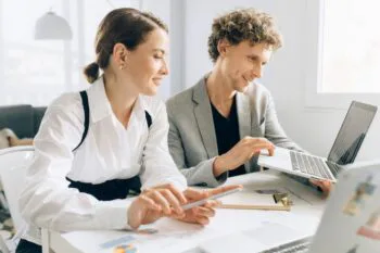 Image of two people in business meeting