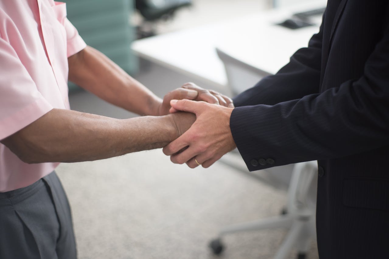 Close-up shot of two people shaking hands
