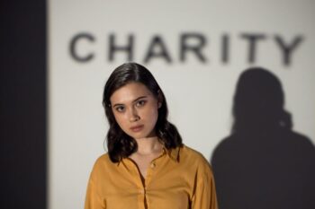 Woman in yellow button-up shirt