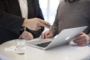Two people having a meeting with laptop