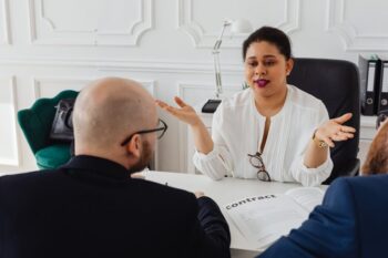 A woman talking at a meeting