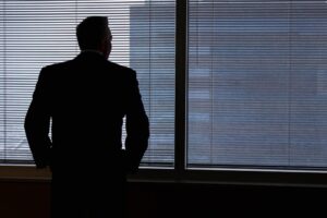 Businessman silhouette in window