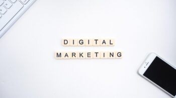 Words digital marketing written and a phone