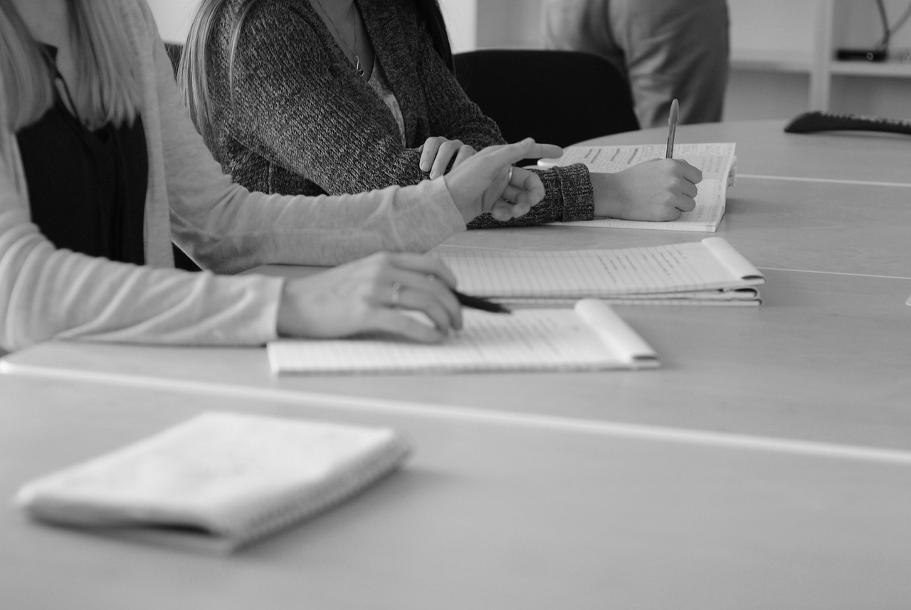 Leaders collaborating on a change management plan and adoption reinforcement.