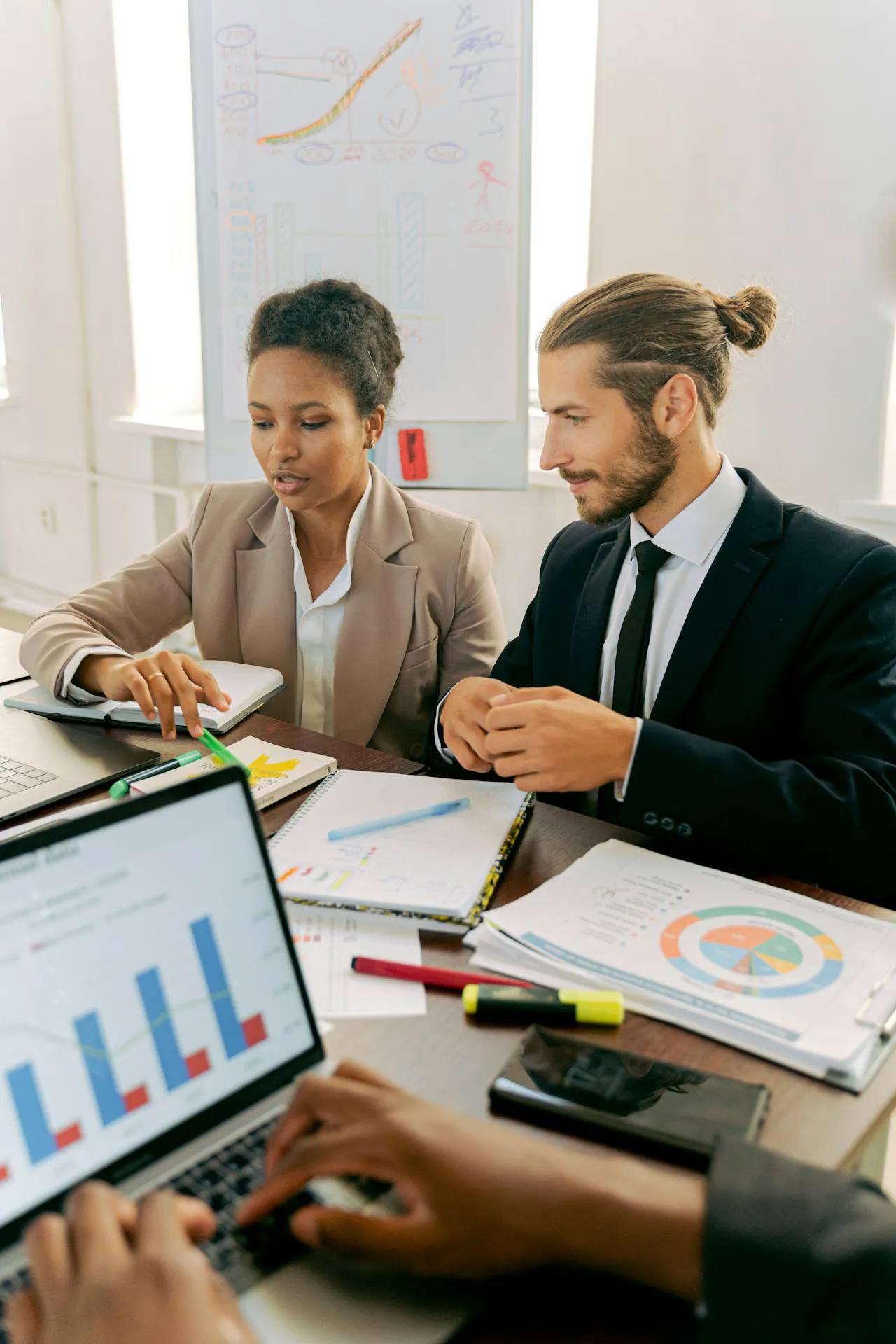 Consultants mapping go-to-market strategy services, target customers, launch channels, deliverables, and KPIs